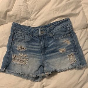Buckle distressed jean shorts
